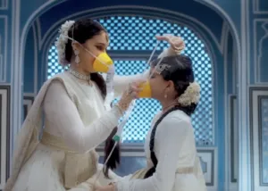 Adult woman assisting child with airline oxygen mask